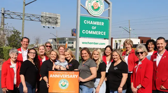 The West Orange Roofing crew in front of the Chamber of Commerce building
